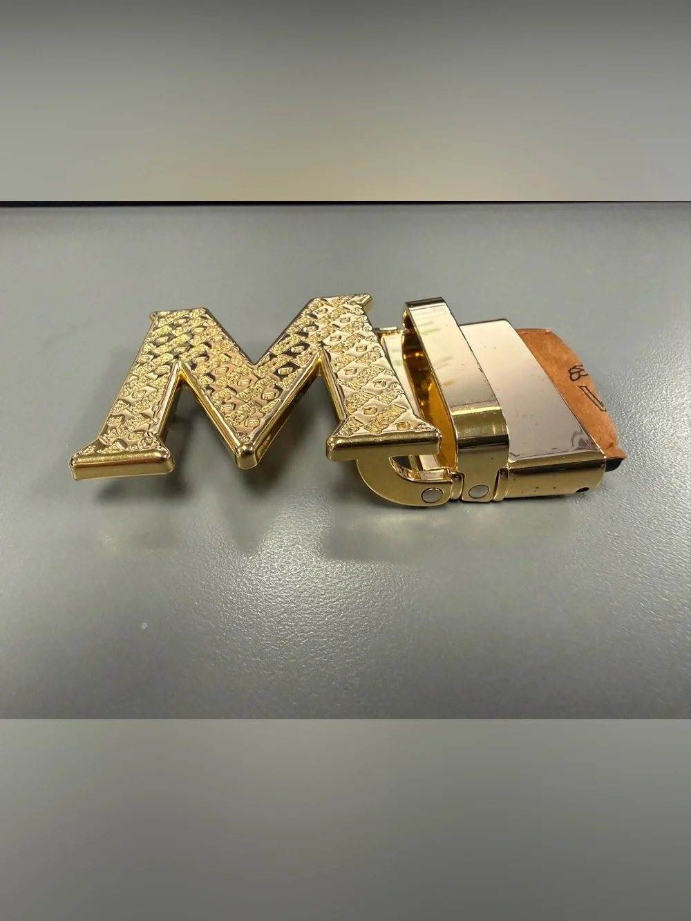 MCM Gold Tone Initial “M” Automatic Ratchet Belt Buckle Designer Logo